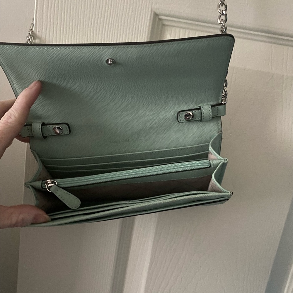 Michael Kors wallet with strap. Used one time. Mint green in color.